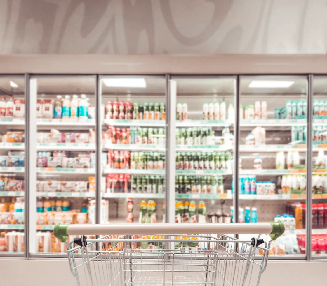Refrigeration Aisle and Grocery Cart
